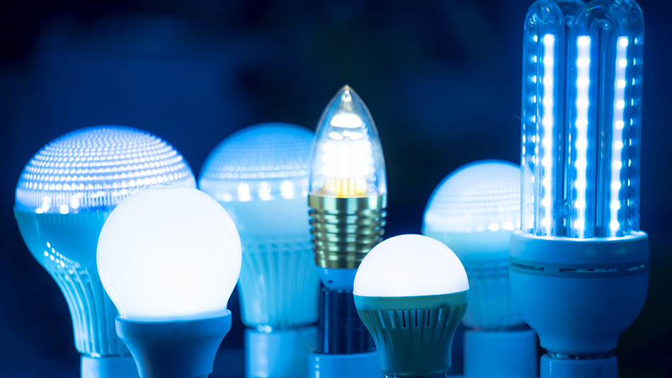 An assortment of LED light bulbs are lit up in front of a dark background