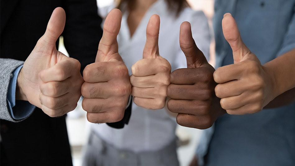 Group of multi-racial hands all giving a thumbs up