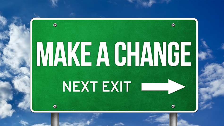 A road sign reads, 'Make a change, next exit' with an arrow pointing right