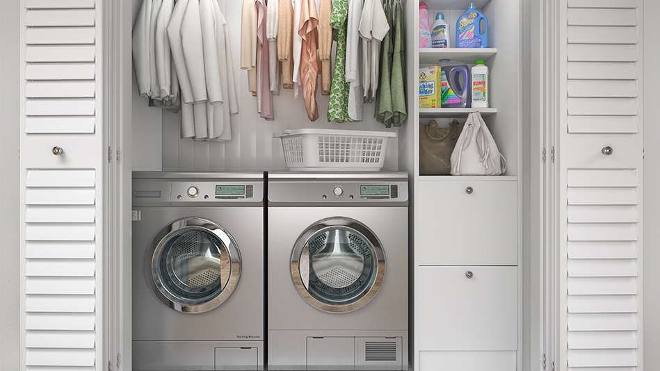 A washer and dryer set are set snugly into a small closet space