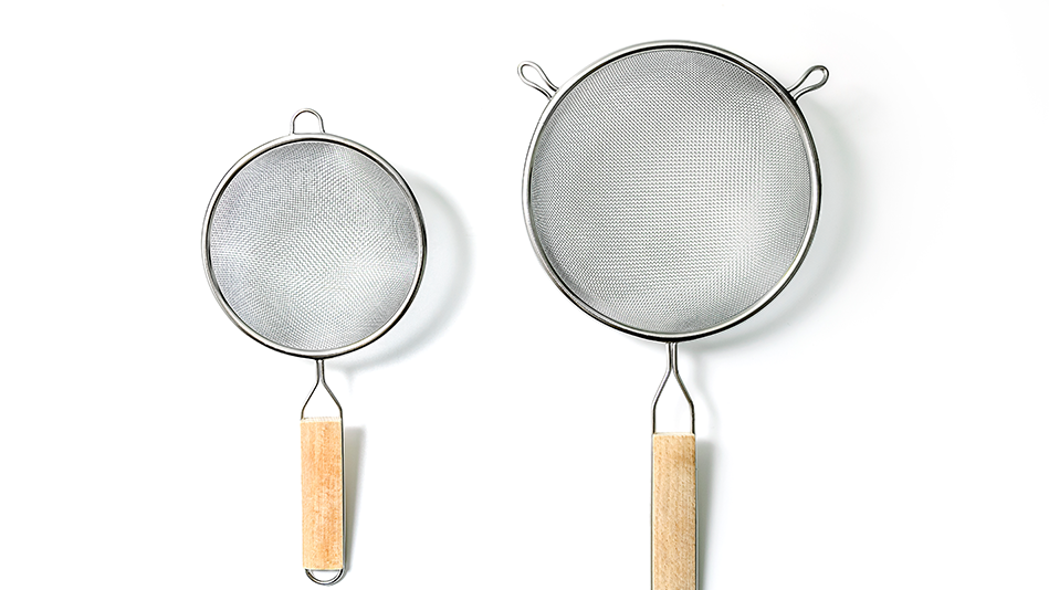 A pair of sieves with wooden and metal handles, one bigger than the other