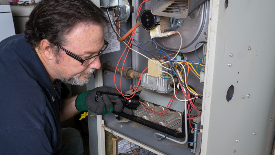 A licensed contractor performs an HVAC tune-up 