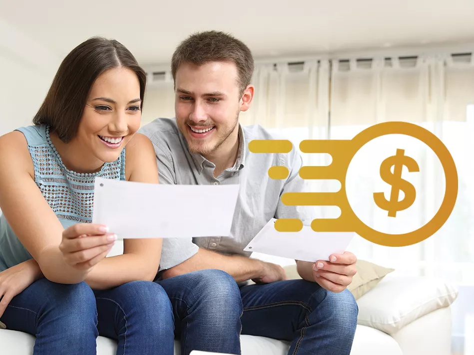 White couple smiles while reviewing a check reimbursement