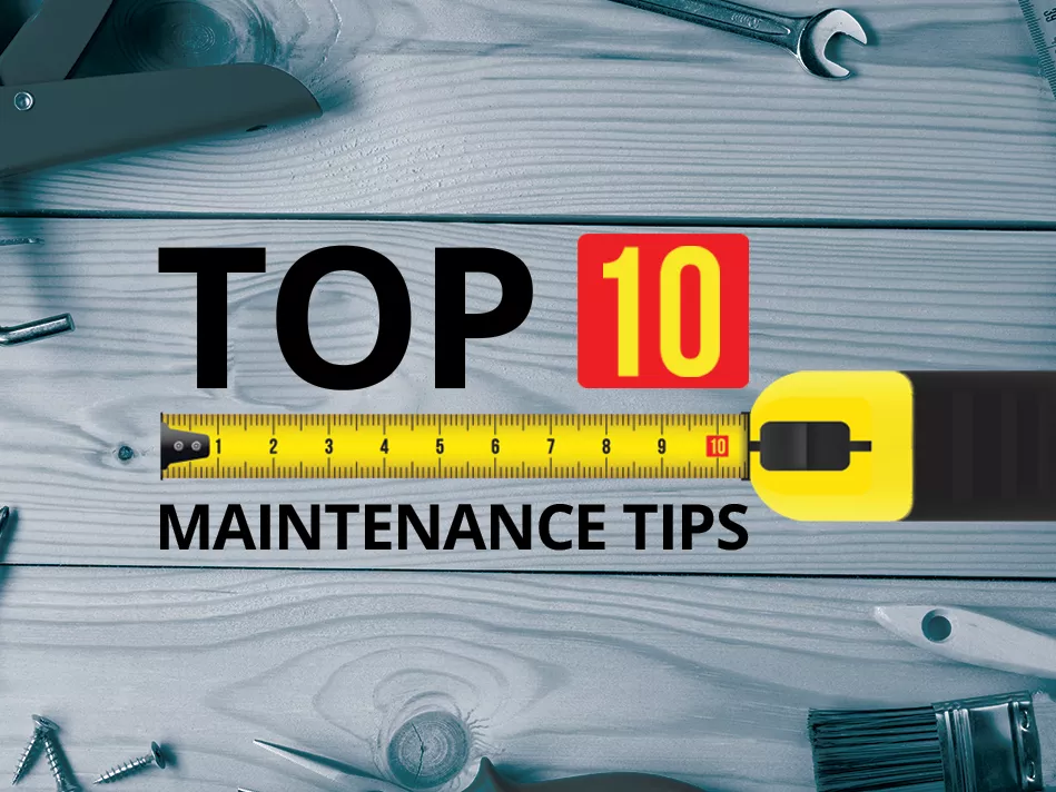 "Top 10 Maintenance Tips" in black block letters, except for the "10", which is in yellow block letters inside a red square; a yellow, black, and red tape measure separates "Top 10" from "Maintenance Tips", all in front of a grayscale background of 3 horizontal wood planks that have parts of tools in frame around the perimeter, with the title directly over the middle plank 