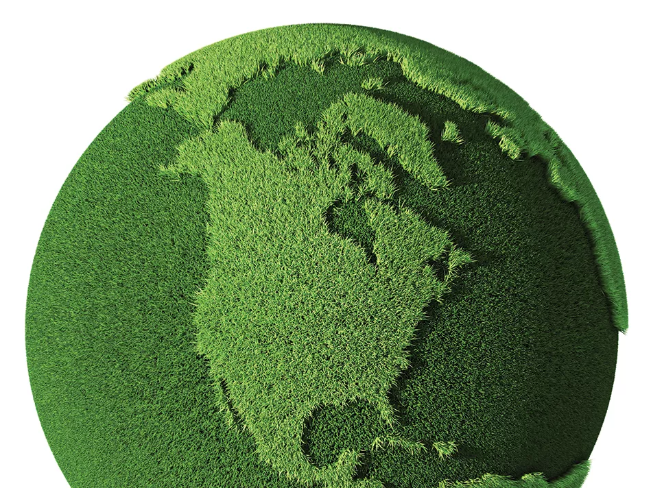 A green globe cut out of grass