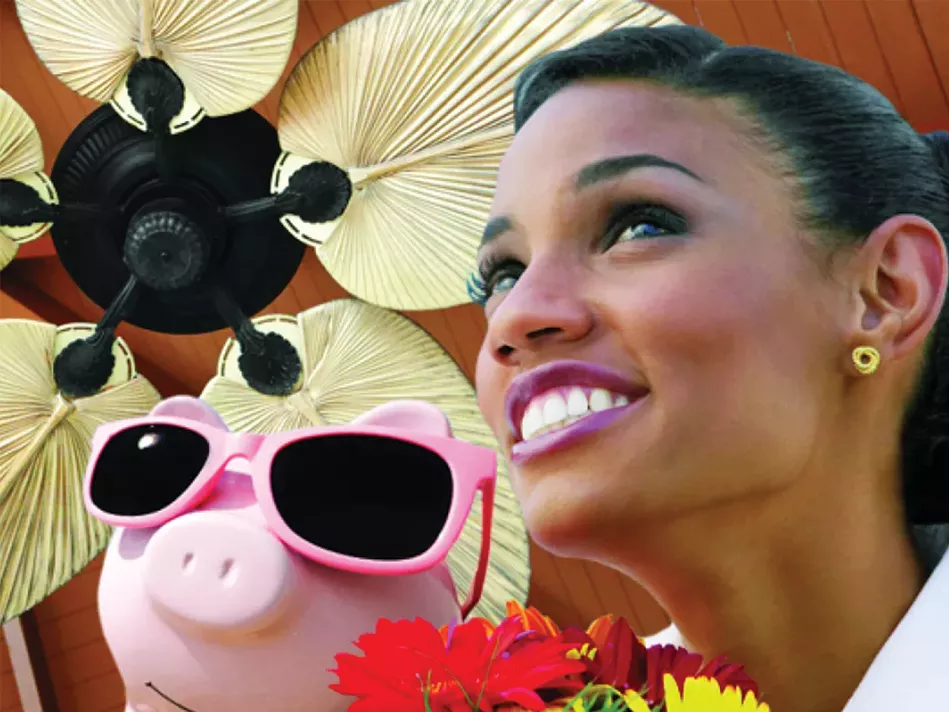 A Black woman holding red and yellow flowers looks up at a black ceiling fan with gold palm blades that sits above a pink piggy bank wearing pink sunglasses