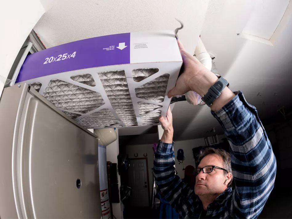 Man replaces 4-inch furnace filter