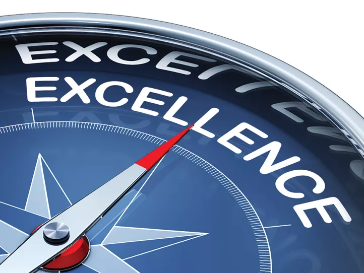 A blue compass points to excellence