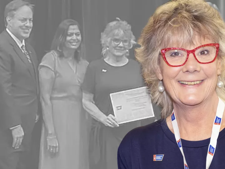 An older white female wearing red glasses featured in front of a photo of herself accepting an award from the ACS