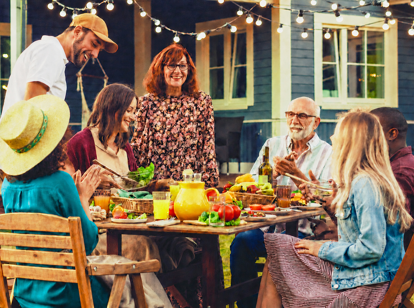 Family sitting around a table eating food.